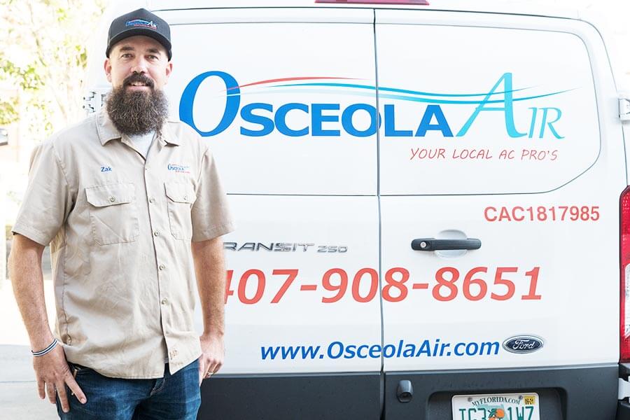 Air Conditioner Repair Owner In Front Of Van