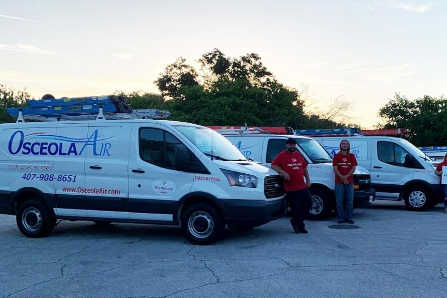 Osceola Team Beside Trucks