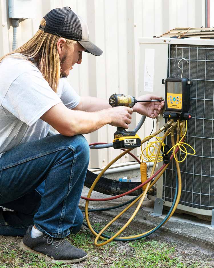 Working On Air Conditioner Repair